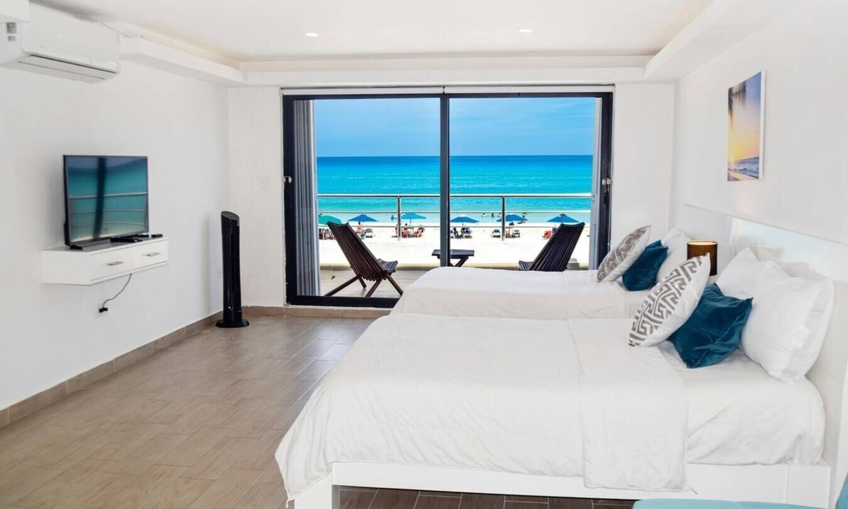 Punta Cancun Apartment | Beach front Villa, great location, steps from the beach!