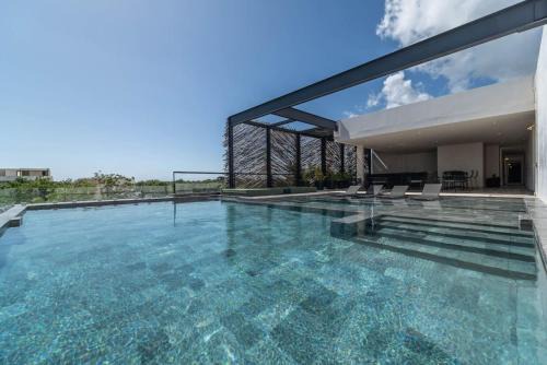 Zama House | Elegant 2BR w Rooftop Pool Close to Beach