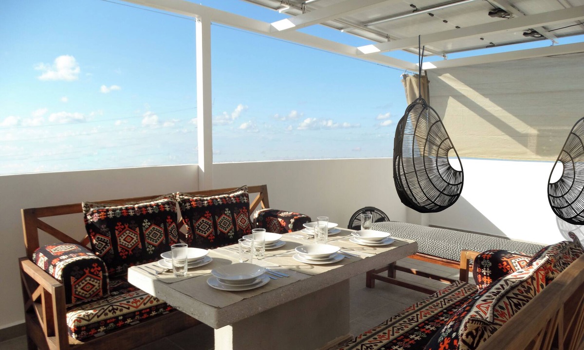 Puerto Juarez Condo | Green Living! Solar-Powered Rooftop Condo with Semi-Olympic Pool-Summer Discount