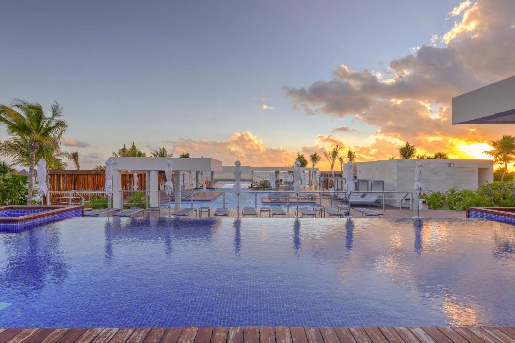 Playa Mujeres Apartment | La Amada Residences Private Beach Getaway with Pools & Gym