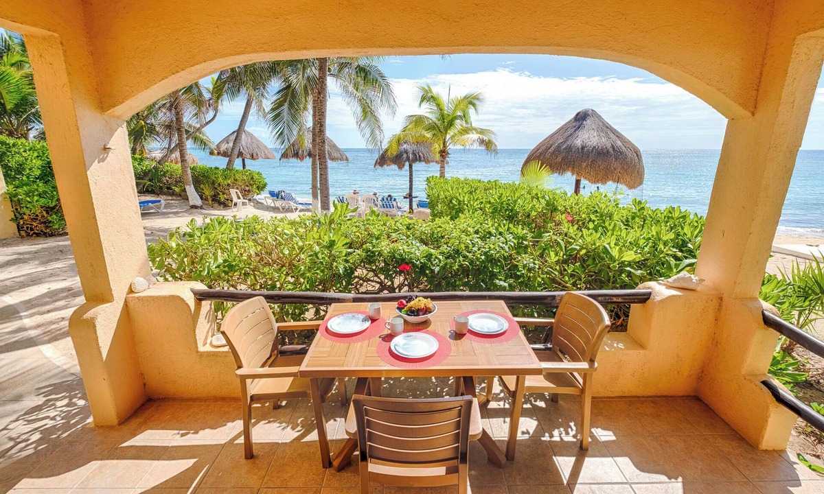 Akumal Condo | Relax at your oceanfront escape on Half Moon Bay. Wake to turquoise views and unwind on your private terrace.
