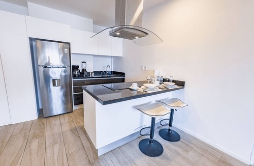 Luis Donaldo Colosio Apartment | 1BR Apartment w/Private Balcony - Rooftop Pool - Walk to Beach & 5th Ave