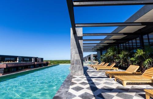 Playa Paraiso Apartment | 1BR - Sea View Rooftop pools steps to Beach & Jaguar Park