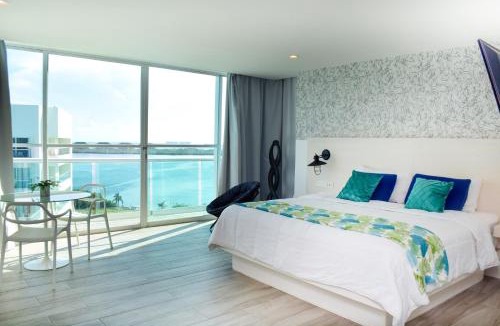 Zona Hotelera Apartment | Beachfront Studio Balcony Pool & Gym