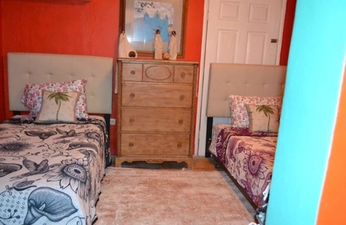 El Puerto Apartment | Eclectic rooms on the Malecon & Sea of Cortez. Furry friends welcome!