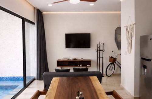Tulum Condo | Escape to Giada Towers, Aldea Zama: 2-bedroom, 2-bathroom apartment with a private jacuzzi on the main terrace and a large L-shaped terrace with a grill and direct access to the pool. Includes 2 bicycles and access to the gym, movie theater, and ck