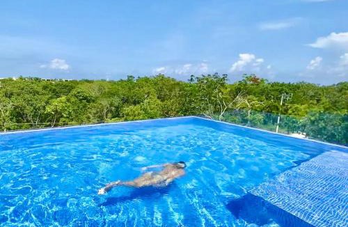Tulum House | EXCLUSIVE BUILDING INFINITY POOL AND GYM RESTAURANTS AND BAR DISTRICT NEARBy