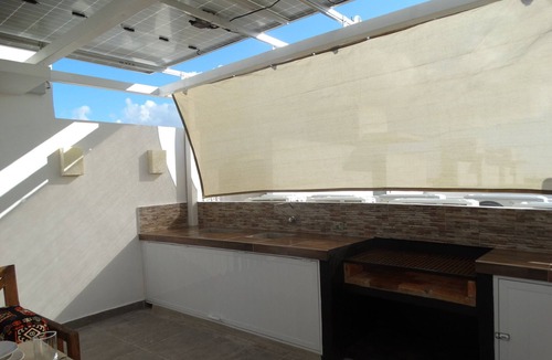 Puerto Juarez Condo | Green Living! Solar-Powered Rooftop Condo with Semi-Olympic Pool-Summer Discount