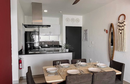 Puerto Juarez Condo | Green Living! Solar-Powered Rooftop Condo with Semi-Olympic Pool-Summer Discount