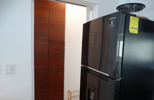 Puerto Juarez Condo | Green Living! Solar-Powered Rooftop Condo with Semi-Olympic Pool-Summer Discount