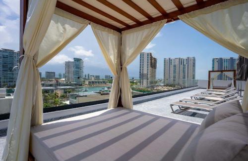 Zona Hotelera Apartment | Luxe Apt 3BR Rooftop Pool Marina & Shopping