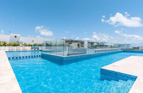 Luis Donaldo Colosio Condo | Modern Condo Steps to 5th Ave and Beach w Rooftop Pool