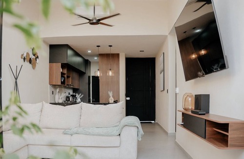 Comala House | Modern house with a private garden and double-height ceiling in Comala