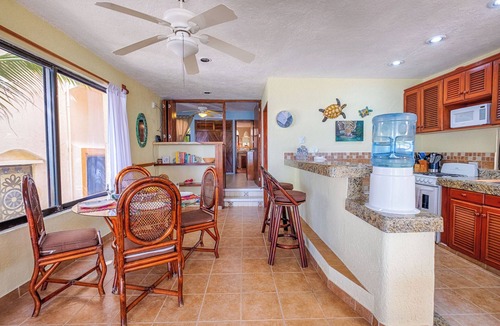 Akumal Condo | Relax at your oceanfront escape on Half Moon Bay. Wake to turquoise views and unwind on your private terrace.