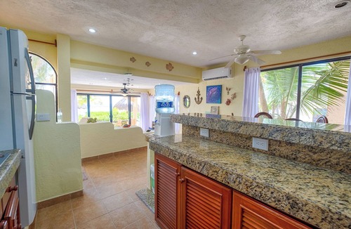Akumal Condo | Relax at your oceanfront escape on Half Moon Bay. Wake to turquoise views and unwind on your private terrace.