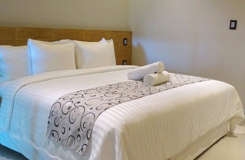 Downtown Cancun Hotel | Relax in 2 Stylish Rooms with Rooftop Sun Terrace in Central Cancún Location