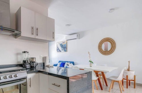 Puerto Juarez Apartment | Relaxing Family Home: Pool, BBQ & Kids' Playground