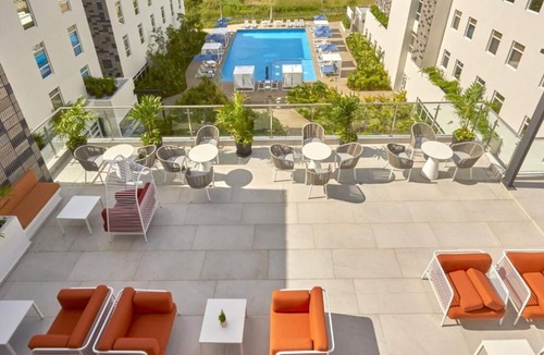 Cancun Hotel | Relaxing Stay Near CUN | 2 Rooms w/Kitchenette, Pool, Rooftop Terrace & Shuttle