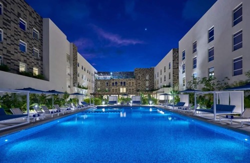 Cancun Hotel | Relaxing Stay Near CUN | 2 Rooms w/Kitchenette, Pool, Rooftop Terrace & Shuttle