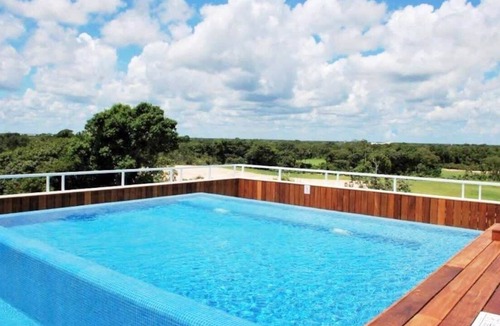 Villa Juarez Condo | Stylish condo in luxury Corasol beach/golf resort