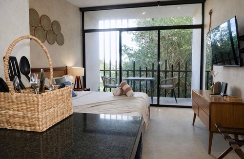 Tulum Apartment | This stylish, art-inspired Tulum condo with private pool access, lush garden vibes, and all the comforts you need for a memorable stay in paradise — perfect for couples or solo travelers.