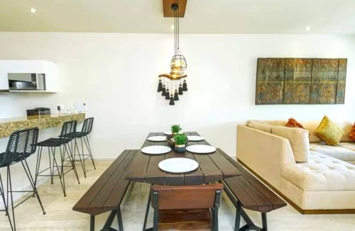 Zama Apartment | Your Tulum escape awaits. Relax in a private rooftop pool, enjoy tropical views from 3 balconies, 3 bedrooms with smart TV's, and stay minutes from beaches, cenotes, dining, and nightlife.