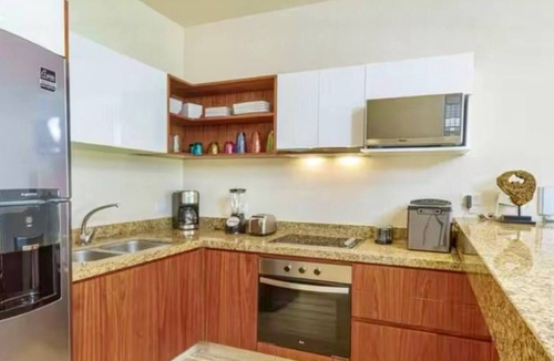 Zama Apartment | Your Tulum escape awaits. Relax in a private rooftop pool, enjoy tropical views from 3 balconies, 3 bedrooms with smart TV's, and stay minutes from beaches, cenotes, dining, and nightlife.