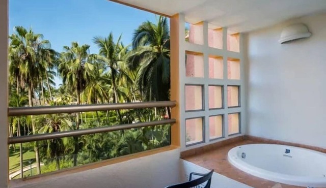 1BR Condo with Scenic Balcony Near the Beach