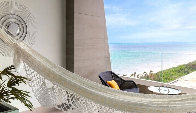 Chic Oceanfront Resort ~ Private Balcony ~ Playa Mujeres’ Tranquil White Sands