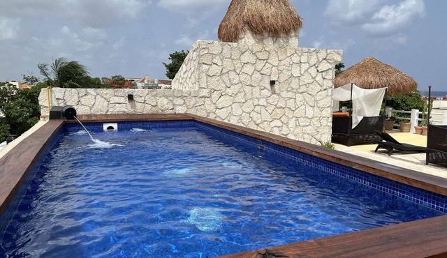 Coastal Escape Suite:Private Balcony, King Bed & Steps to the Cozumel Waterfront