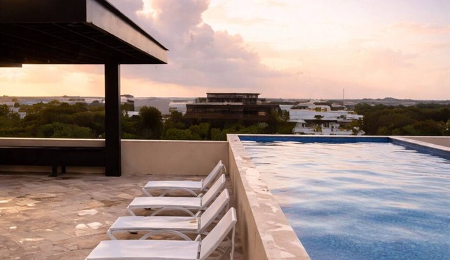 Escape to Giada Towers, Aldea Zama: 2-bedroom, 2-bathroom apartment with a private jacuzzi on the main terrace and a large L-shaped terrace with a grill and direct access to the pool. Includes 2 bicycles and access to the gym, movie theater, and ck