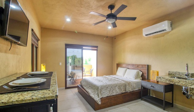 Ideal tropical escape with free WiFi, balcony, kitchenette & snack shack
