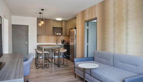 Two-Bedroom Suite with Balcony and Partial Golf View