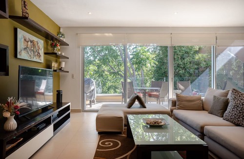 Playacar Fase II Condo | 4 Pools and Budget Penthouse in Vaiven. From BRIC Vacation Rentals
