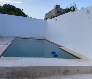 Chicxulub Puerto House | Minimalist house with pool and patio